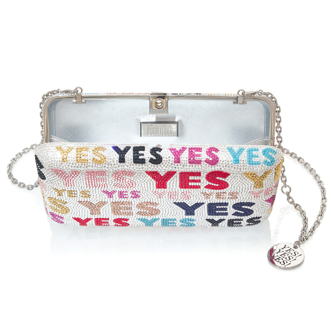 This incredible Judith Leiber x Ashley Longshore bag comes with a 12x12 painting!!! So it's a TWOFER!  Bag and artwork will ship within 8-10 weeks.  My team will reach out to work with you on your ARTWORK preference!!!  13,000 handset crystals and 18 different crystal varieties  Nickel plated frame and silver plated crossbody chain with Ashley Longshore x Judith Leiber LOGO