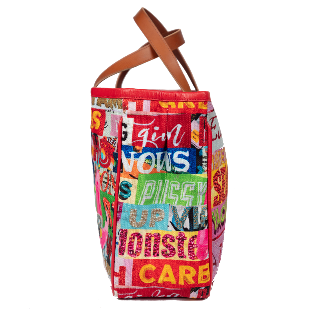 THE FIRST Tote available from the fabric I created for Project Runway... I pulled sections from my labeled artworks and popped them into this SUPER chic tote!!! It's got so much POP and is so much FUN!!!!!! YAY!!!!! 20" x 12" x 5" high quality cotton canvas tote trimmed in 100% Nappa Leather with 7" handles.