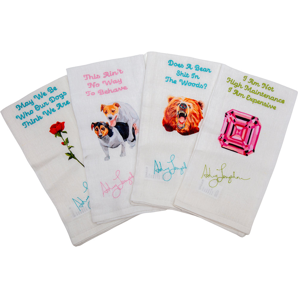 Set of four decorative towels with various designs and text on a white background