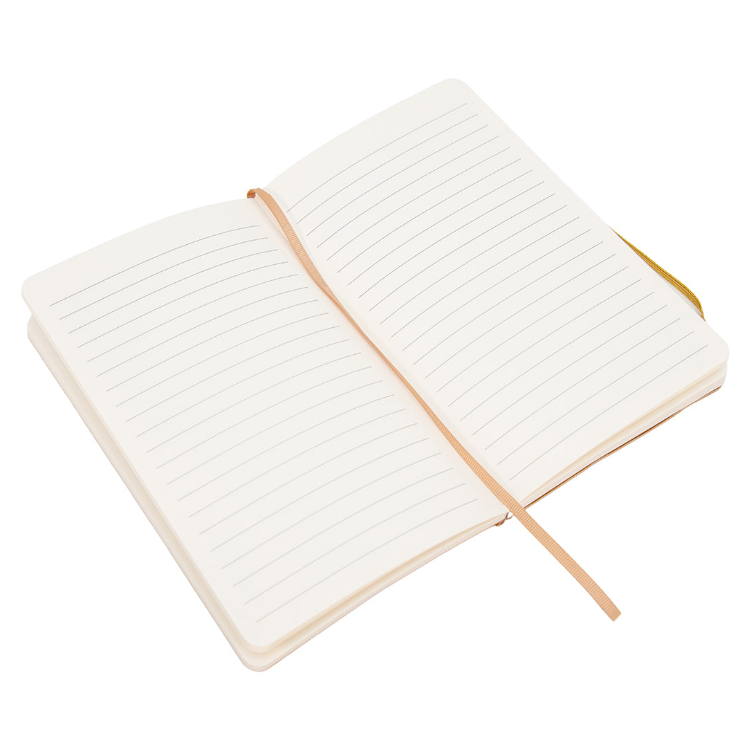 Open journal showing cream-colored lined pages with a gold ribbon bookmark.