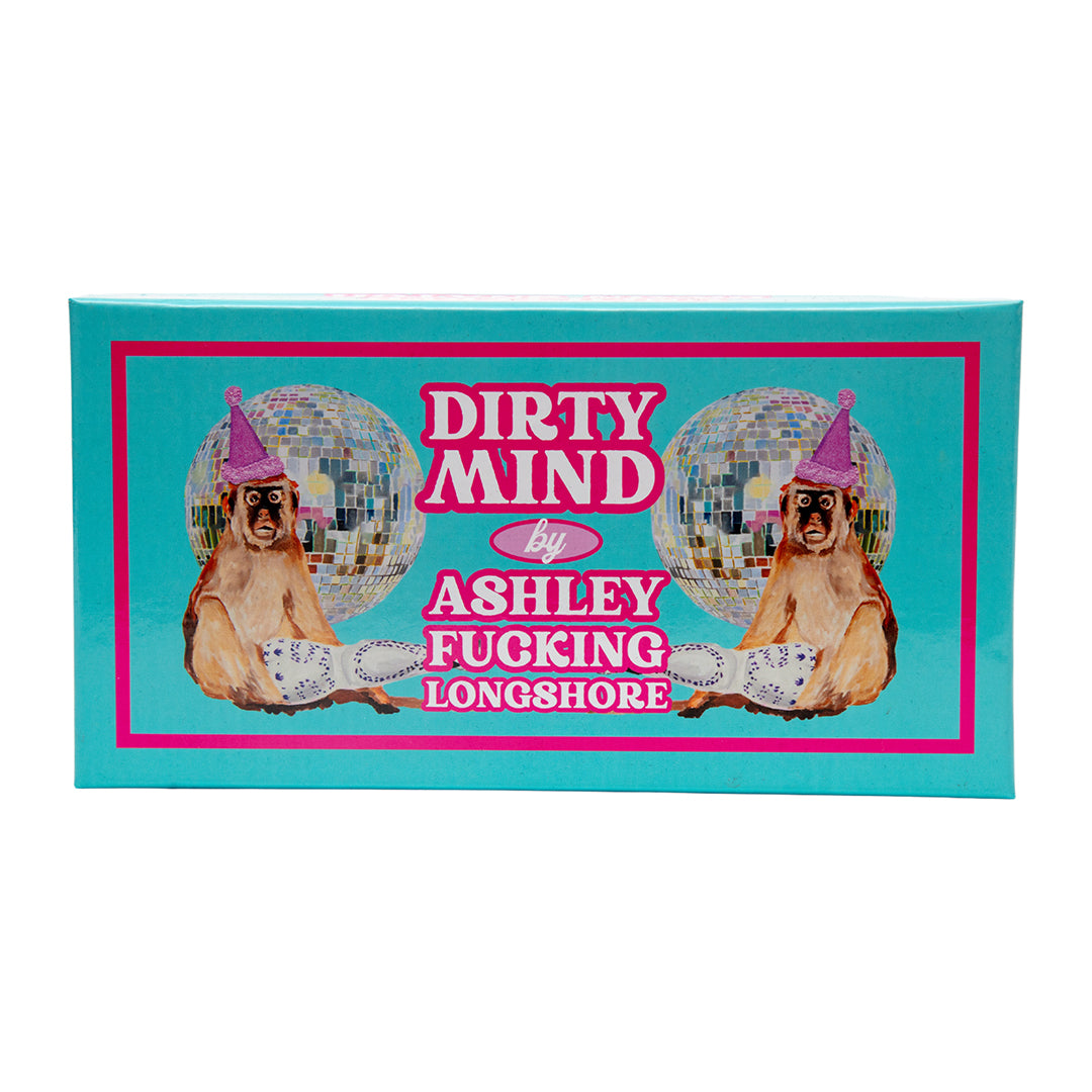 Front view of Ashley Longshore’s Dirty Mind Brain Snatch game box with disco balls, monkeys in party hats, and bold pink typography on turquoise background.
