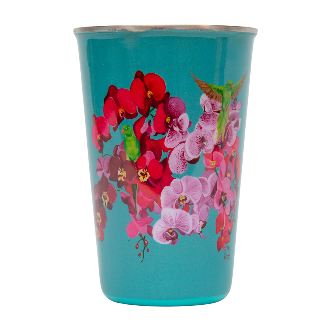 Turquoise cup with floral design on a white background