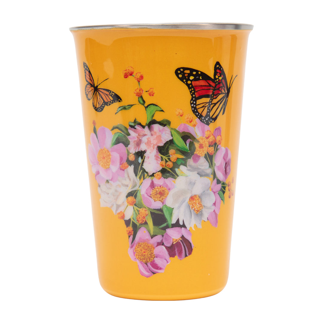 Yellow tumbler with floral and butterfly design on a white background