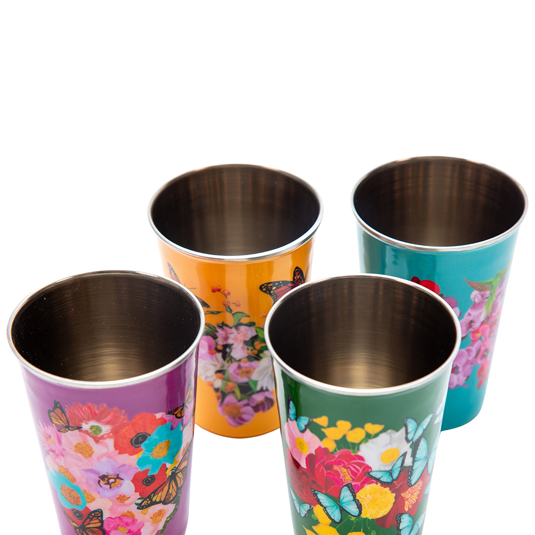 Set of four colorful tumblers with floral and butterfly designs on a white background