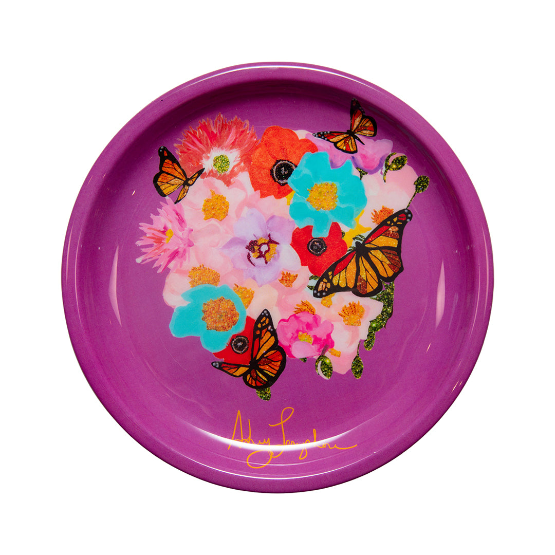 Purple plate with colorful flowers and butterflies on a white background