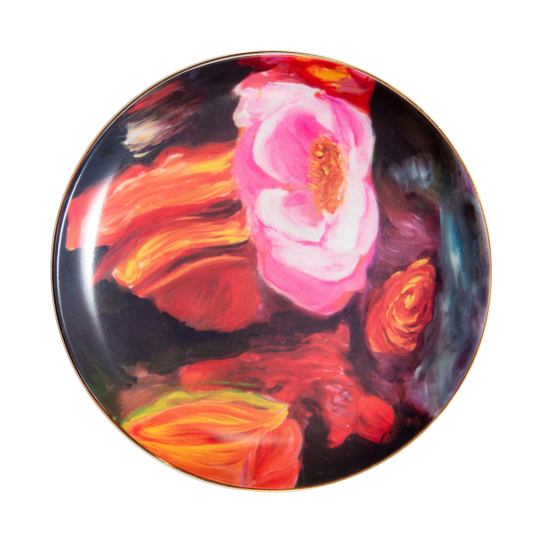 Porcelain dessert plate featuring vivid red and pink flower artwork with gold rim.
