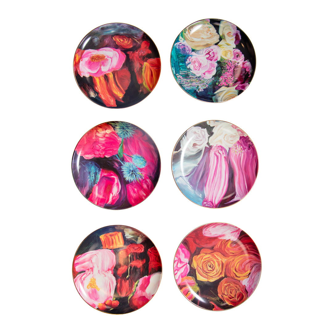 Set of six Ashley Longshore Monette Dessert Plates arranged in a circle showing the variety of floral artwork.

