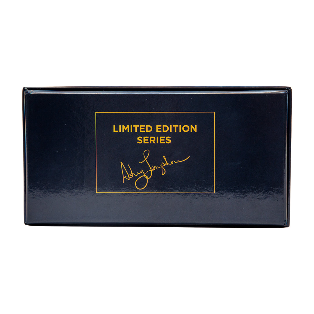 Detail shot of the Politics Are a Drag Brain Snatch game box with gold foil lettering and Ashley Longshore signature branding.