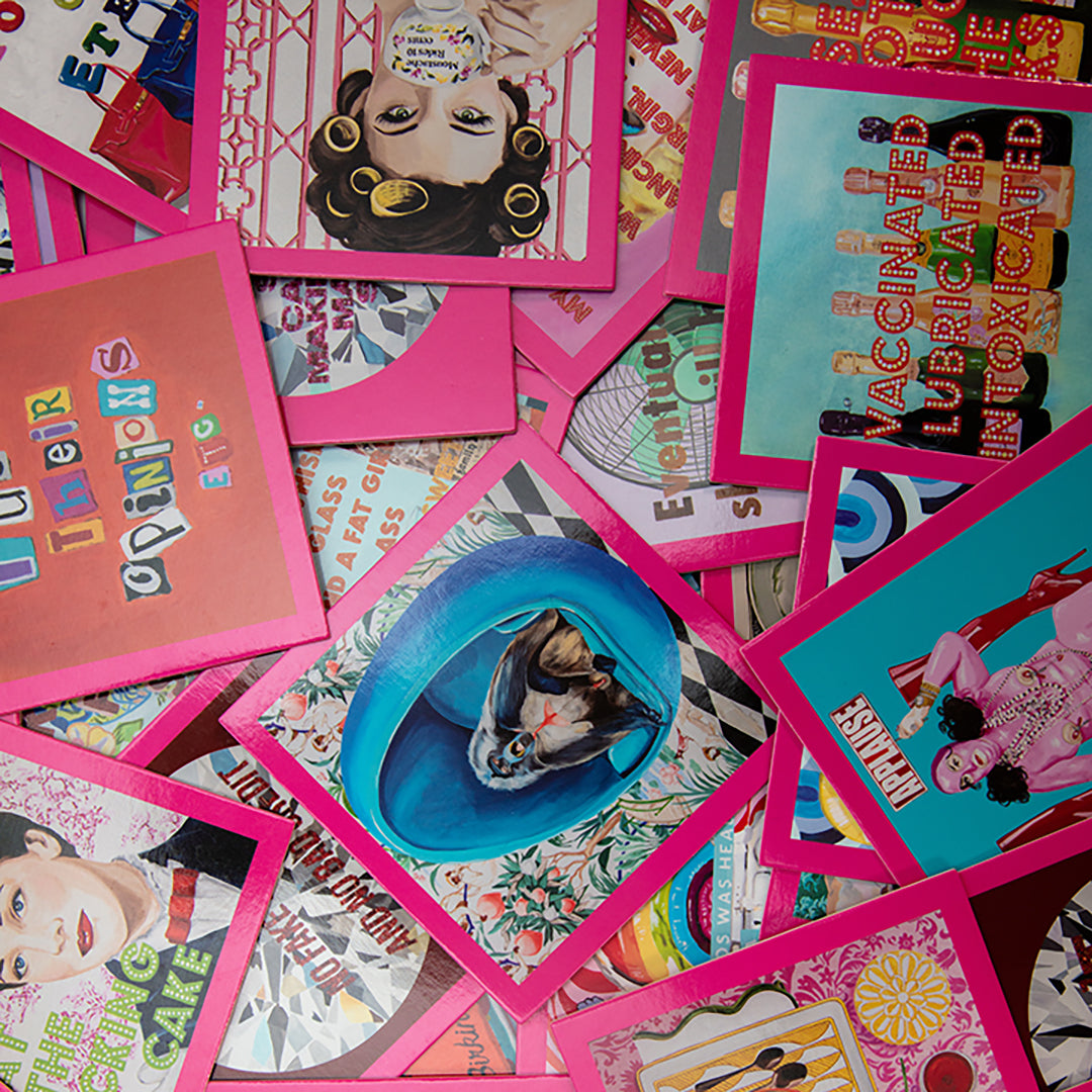 Collection of colorful cards with various designs and text on a pink background