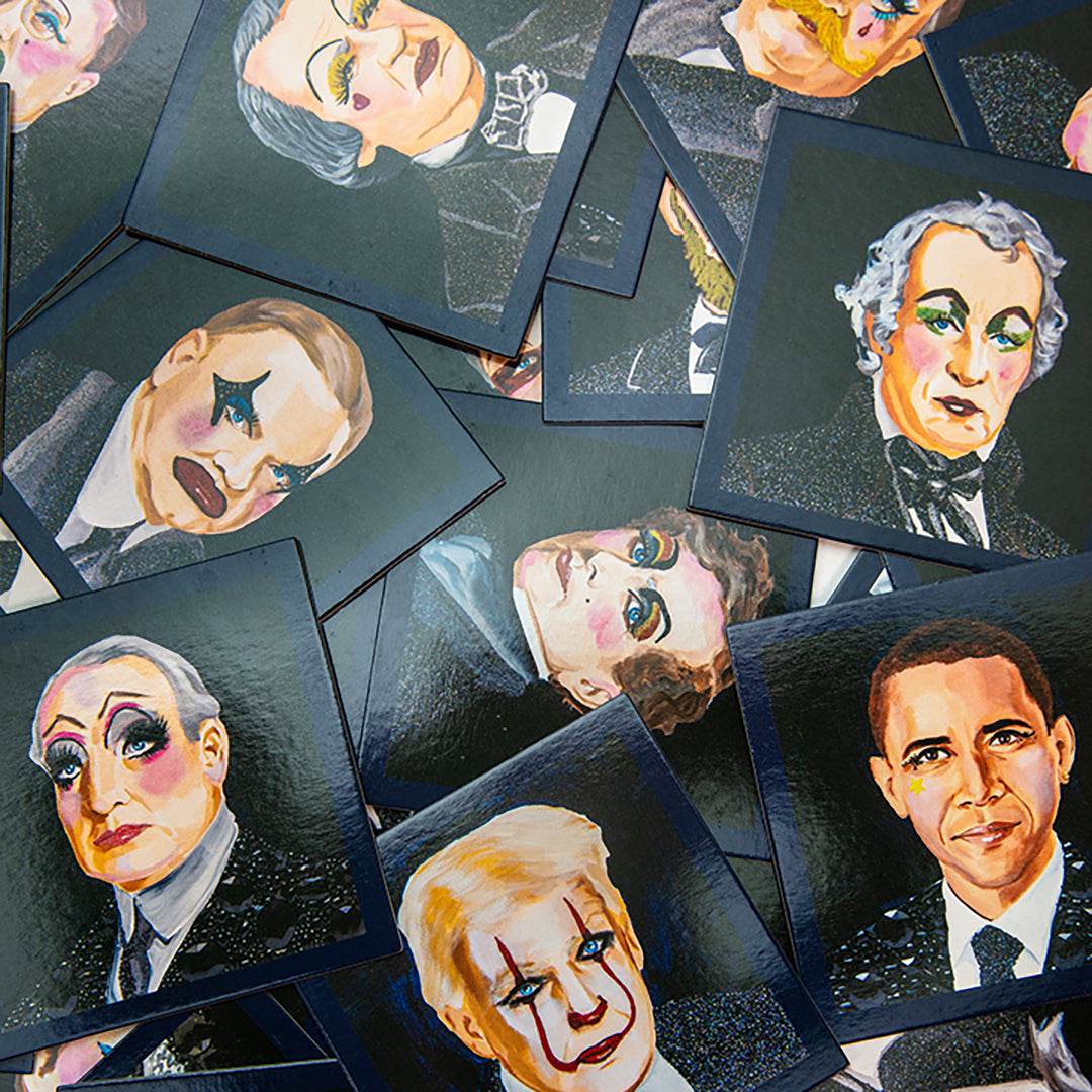 Open Politics Are a Drag memory game box showing pairs of glossy cards with Ashley Longshore’s vibrant portraits of U.S. presidents in full drag glam.