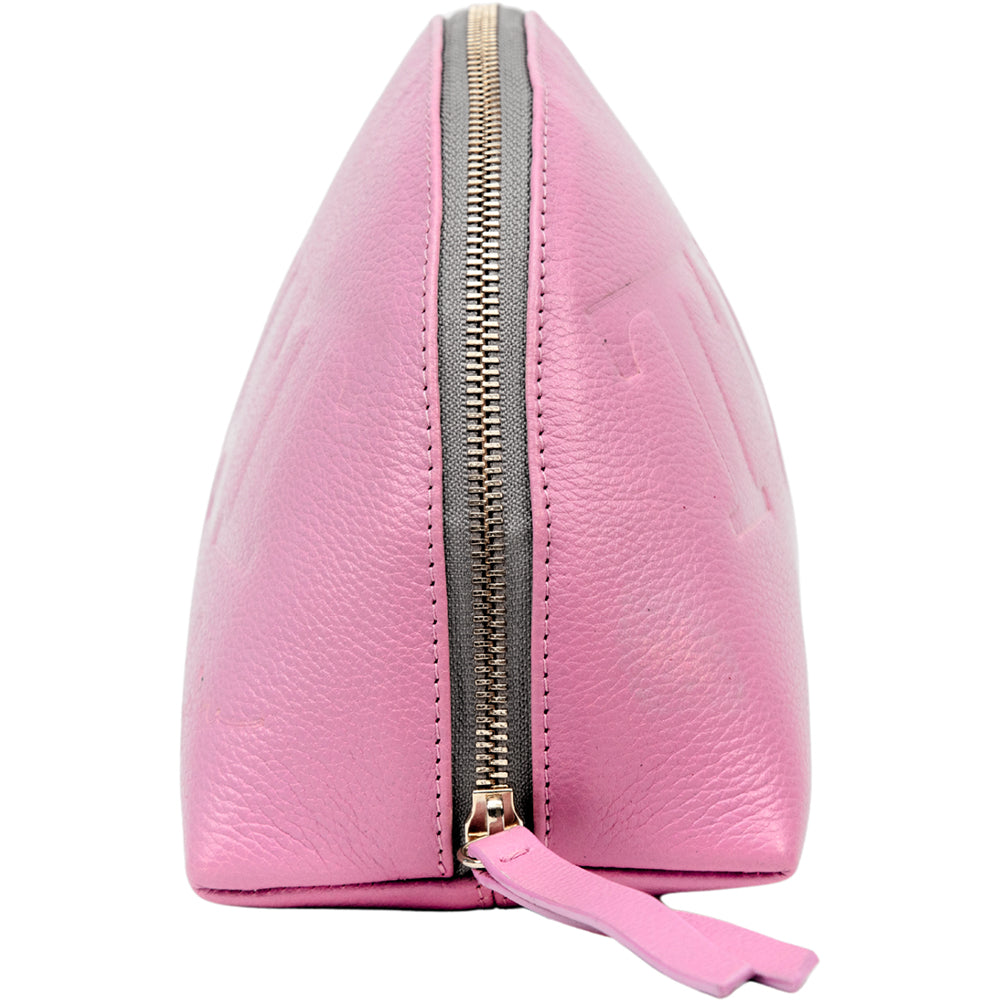 Side profile of the pink leather pouch showing the gold zipper and leather pull tab.