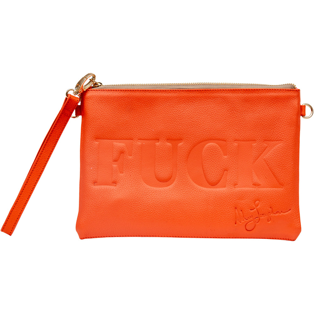 Mandarin orange leather bag with wristlet strap attached to gold hardware.