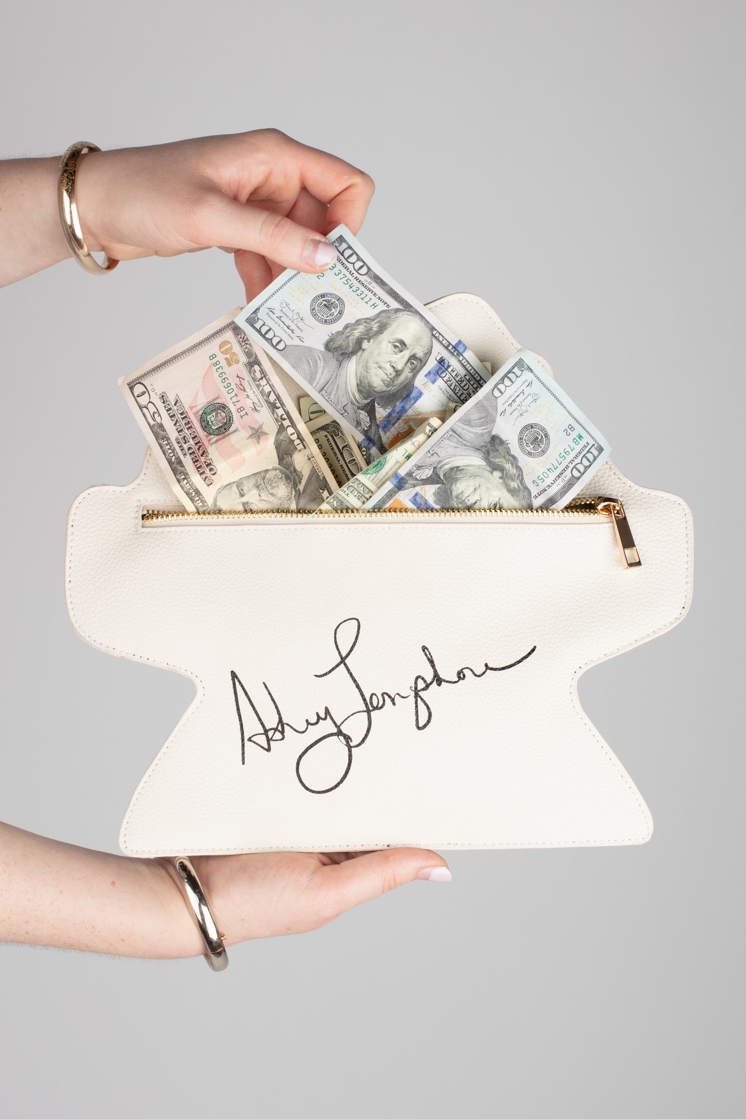 This BOHEMIAN GODDESS OF THE ARTS...FEARLESS AND BEAUTIFUL is ALWAYS a CONVO STARTER on your arm!!!!  SHE IS PERFECT, JUST LIKE U!!! EVERYTHING THAT MADE FRIDA AMAZING IS IN ALL OF YOU!!! AND SO MUCH RANDOM STUFF WILL FIT IN THIS BAG…  Specialty Item -- designed exclusively for YOU from my original art!!!!  Uniquely shaped leather clutch bag with image on the front and contrasting zipper as well as Ashley's Signature on the back. Vegan Leather. Dimensions: 10''. 