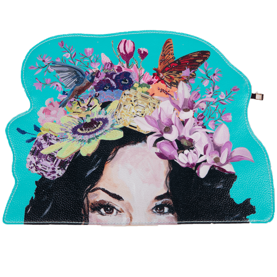 A colorful vegan leather clutch bag with a floral design and a portrait of a woman's face with a flower for each eye, set against a blue background.
